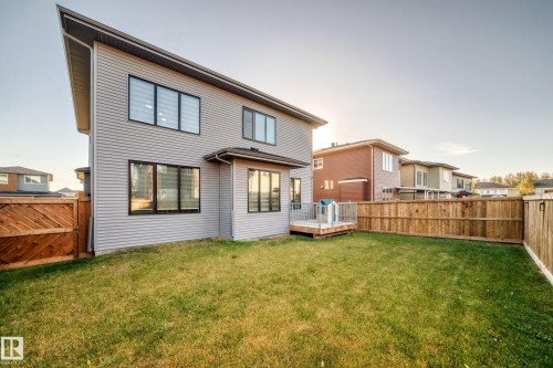 Back of property featuring a wooden deck and a fenced backyard - 42 Elwyck Gate, Spruce Grove, AB - Outdoor With Exterior