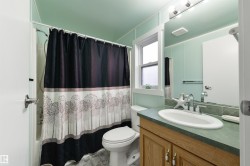 Full bathroom featuring vanity and shower / tub combo - 