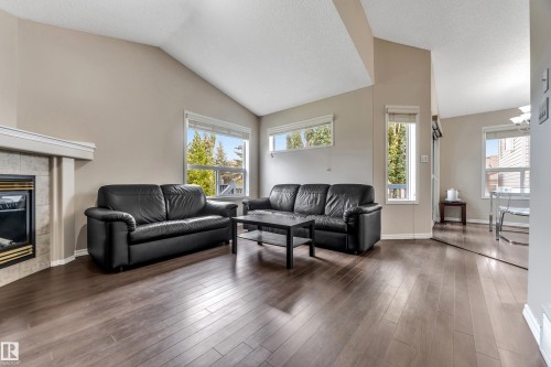 3320 27 Avenue, Edmonton, AB - Indoor Photo Showing Living Room With Fireplace