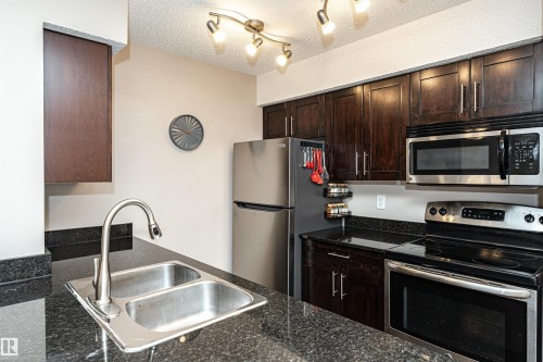 321 1070 Mcconachie Boulevard, Edmonton, AB - Indoor Photo Showing Kitchen With Stainless Steel Kitchen With Double Sink
