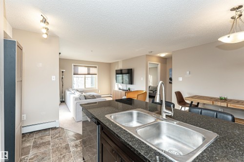 321 1070 Mcconachie Boulevard, Edmonton, AB - Indoor Photo Showing Kitchen With Double Sink