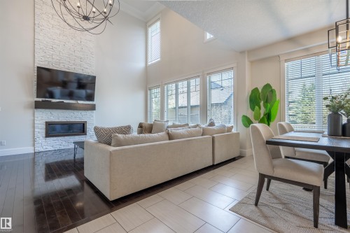 20 10550 Ellerslie Road, Edmonton, AB - Indoor Photo Showing Living Room With Fireplace