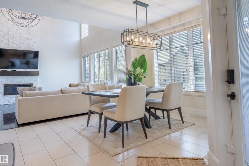 20 10550 Ellerslie Road, Edmonton, AB - Indoor Photo Showing Dining Room With Fireplace
