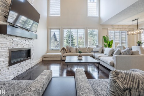 20 10550 Ellerslie Road, Edmonton, AB - Indoor Photo Showing Living Room With Fireplace