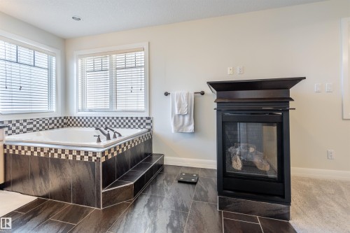 20 10550 Ellerslie Road, Edmonton, AB - Indoor With Fireplace