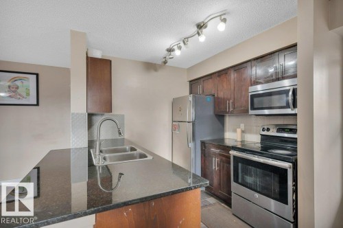 201 111 Watt Common, Edmonton, AB - Indoor Photo Showing Kitchen With Double Sink