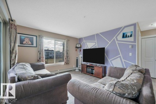 201 111 Watt Common, Edmonton, AB - Indoor Photo Showing Living Room