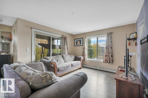 201 111 Watt Common, Edmonton, AB - Indoor Photo Showing Living Room