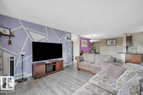201 111 Watt Common, Edmonton, AB - Indoor Photo Showing Living Room