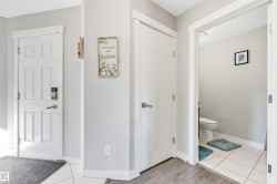 Foyer entrance with light tile patterned floors - 