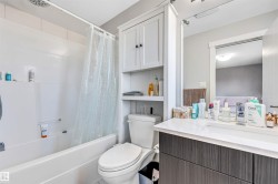 Bathroom featuring shower / tub combo and vanity - 