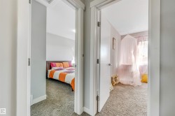 Hall featuring carpet and baseboards - 