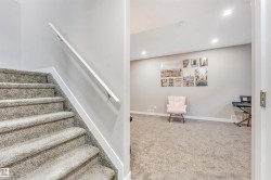 Stairs with carpet and recessed lighting - 