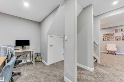 Office space featuring light colored carpet and recessed lighting - 