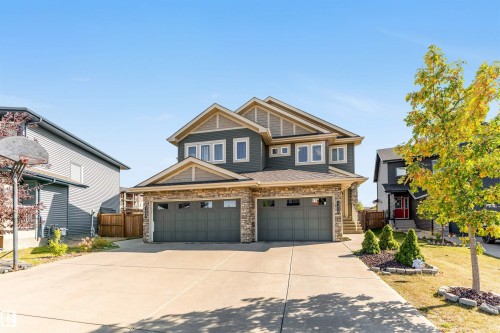 Craftsman-style home with stone siding, driveway, and a garage - 3478 Weidle Way, Edmonton, AB - Outdoor With Facade