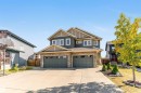 Craftsman-style home with stone siding, driveway, and a garage - 3478 Weidle Way, Edmonton, AB  - Outdoor With Facade 