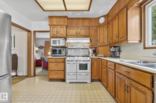 7708 98A Avenue Nw, Edmonton, AB - Indoor Photo Showing Kitchen With Double Sink