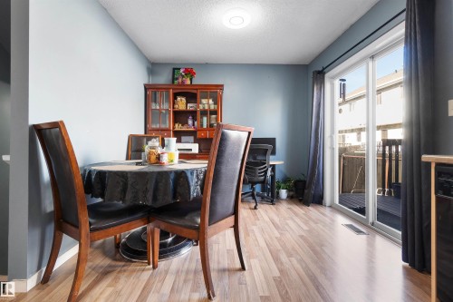 Dining space with light wood-style flooring and a textured ceiling - 36 2503 24 Street, Edmonton, AB - Indoor Photo Showing Office