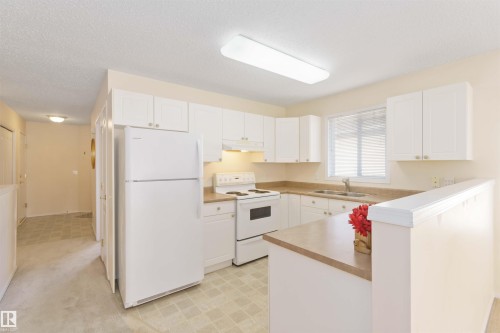 1 14428 Miller Boulevard, Edmonton, AB - Indoor Photo Showing Kitchen With Double Sink