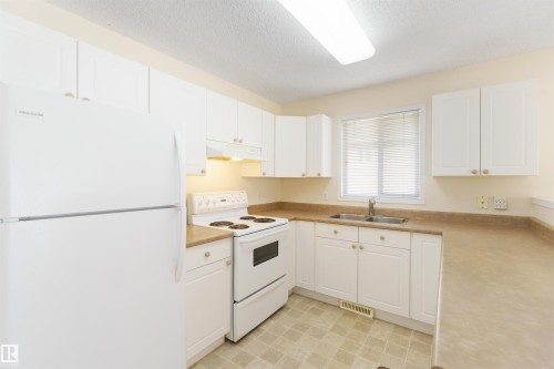 1 14428 Miller Boulevard, Edmonton, AB - Indoor Photo Showing Kitchen With Double Sink