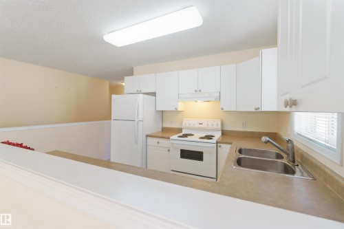 1 14428 Miller Boulevard, Edmonton, AB - Indoor Photo Showing Kitchen With Double Sink