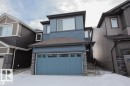 View of front facade featuring stone siding and a shingled roof - 22143 80 Avenue, Edmonton, AB  - Outdoor 