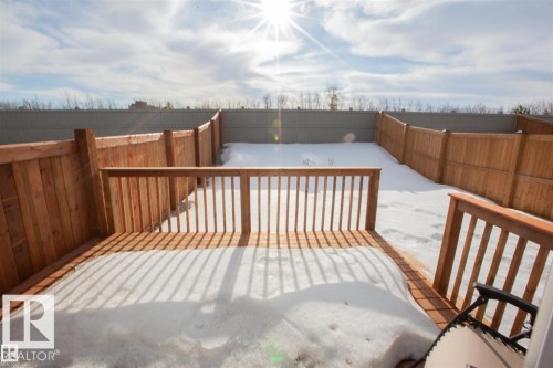 Snow covered deck featuring a fenced backyard - 22143 80 Avenue, Edmonton, AB - Outdoor With Exterior
