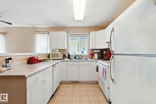 2 14428 Miller Blvd, Edmonton, AB - Indoor Photo Showing Kitchen With Double Sink