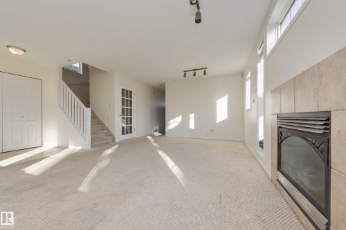 Edmonton, AB - Indoor Photo Showing Other Room With Fireplace