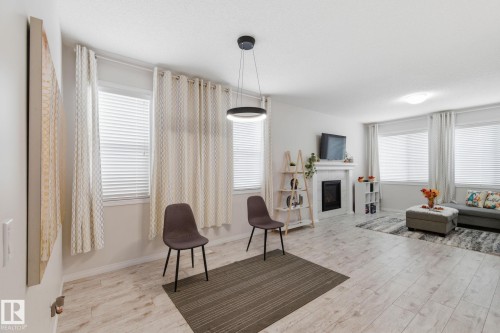 1511 Secord Rd Nw, Edmonton, AB - Indoor Photo Showing Other Room With Fireplace