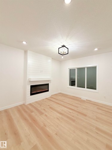 3136 Magpie Way Nw, Edmonton, AB - Indoor Photo Showing Living Room With Fireplace
