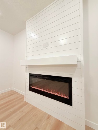 3136 Magpie Way Nw, Edmonton, AB - Indoor Photo Showing Living Room With Fireplace