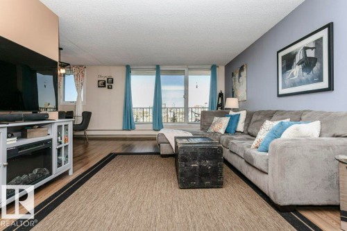 605 10135 Saskatchewan Drive, Edmonton, AB - Indoor Photo Showing Living Room With Fireplace