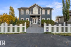 View of front of home featuring a fenced front yard and a balcony - 