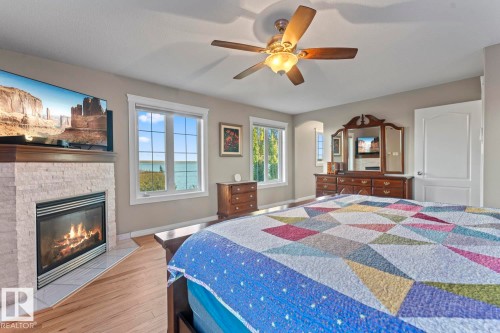 1512 Horseshoe Bay Estates, Cold Lake, AB - Indoor Photo Showing Bedroom With Fireplace