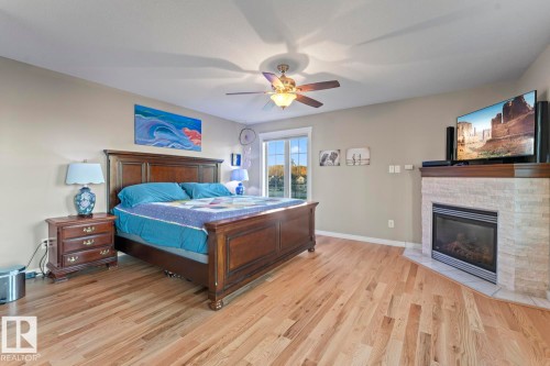 1512 Horseshoe Bay Estates, Cold Lake, AB - Indoor Photo Showing Bedroom With Fireplace