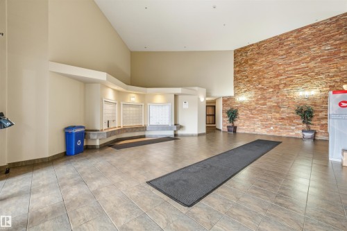 228 5350 199 Street, Edmonton, AB - Indoor Photo Showing Other Room With Fireplace