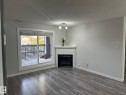 115 2098 Blackmud Creek Drive Sw, Edmonton, AB  - Indoor Photo Showing Living Room With Fireplace 