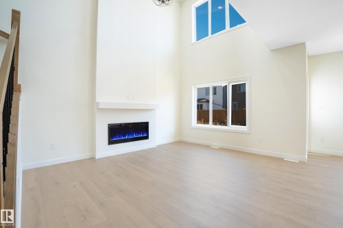 2033 209A Street, Edmonton, AB - Indoor Photo Showing Living Room With Fireplace