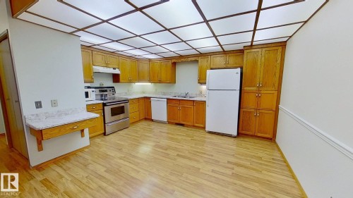 3924 56A Street Close, Camrose, AB - Indoor Photo Showing Kitchen With Double Sink