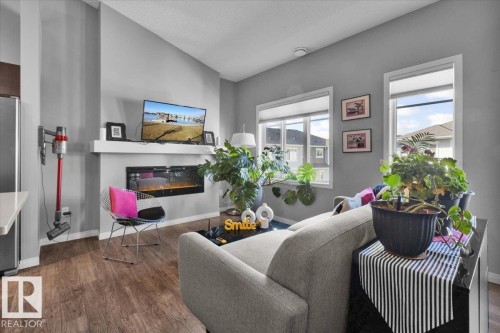 77 2905 141 Street, Edmonton, AB - Indoor Photo Showing Living Room With Fireplace