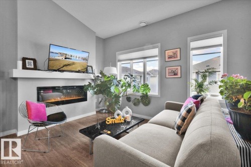 77 2905 141 Street, Edmonton, AB - Indoor Photo Showing Living Room With Fireplace