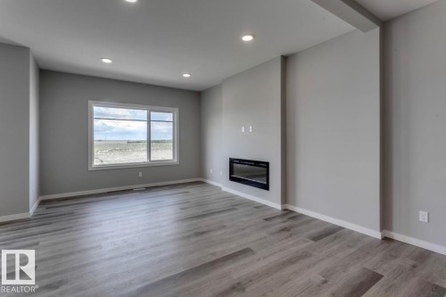 40 Gambel Loop, Spruce Grove, AB - Indoor Photo Showing Living Room With Fireplace