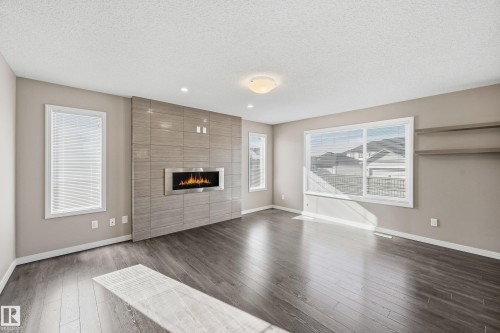 3552 Claxton Crescent, Edmonton, AB - Indoor Photo Showing Living Room With Fireplace