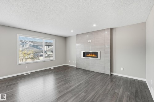 3528 Claxton Crescent, Edmonton, AB - Indoor Photo Showing Living Room With Fireplace
