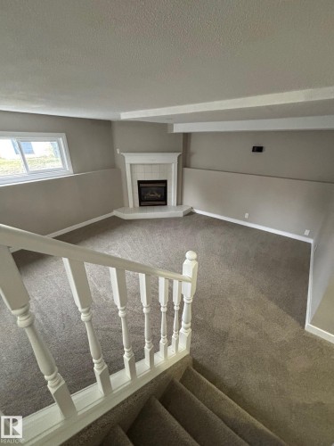 46 Matthew Road, Spruce Grove, AB - Indoor Photo Showing Other Room With Fireplace