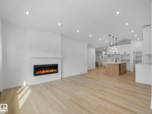 3325 Chickadee Drive, Edmonton, AB - Indoor Photo Showing Living Room With Fireplace