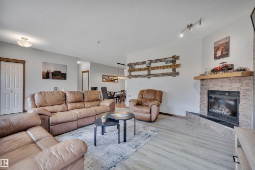 250023 Twp Road 480, Rural Wetaskiwin County, AB - Indoor Photo Showing Living Room With Fireplace