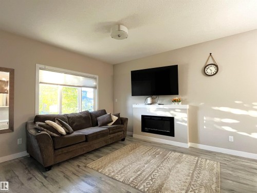 729 Berg Loop, Leduc, AB - Indoor Photo Showing Living Room With Fireplace