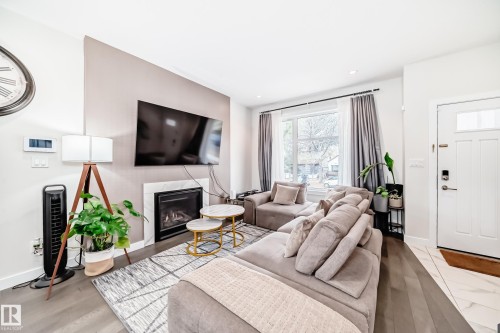 12345 85 Street, Edmonton, AB - Indoor Photo Showing Living Room With Fireplace